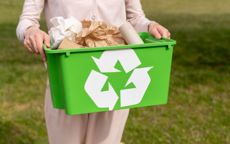 Woman holding recylcing basket